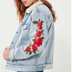 Levi’s embroidered rose sherpa denim jacket.